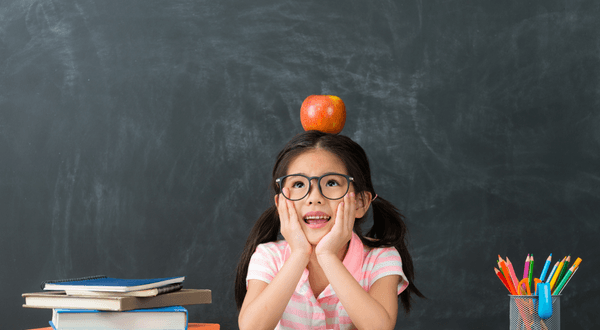 girl with apple on her head